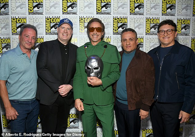 The 51-year-old producer (2-L, pictured last Saturday), whose films have grossed a combined $30 billion, showed no signs of slowing Marvel's profit train by reintroducing Robert Downey Jr. (M) at Comic-Con as Doctor Doom in two upcoming Avengers films.