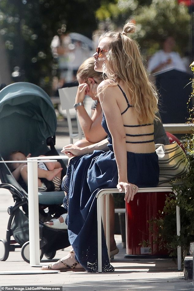 The mother-of-one, who welcomed son Wilburn in 2022 with husband Harry Wentworth-Stanley, styled her blonde locks into a half-up bun.