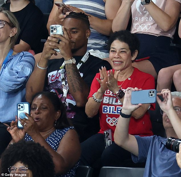 Jonathan, 29, was seen videotaping Simone, 27, as she performed, and applauded loudly after she finished her jump, for which she earned a score of 15.766, earning her the top spot so far.