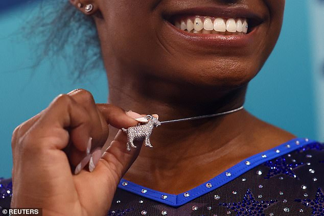 She showed off her goat necklace after winning gold in the all-around gymnastics event