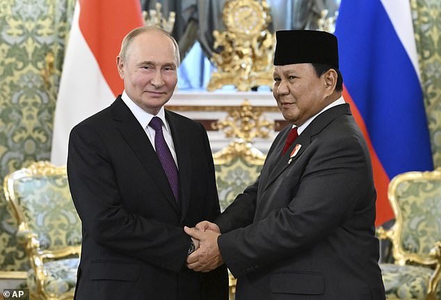 The request was made as part of mandatory forms Gershkovich completed as part of her request for presidential clemency from Vladimir Putin, pictured with Indonesian Defense Minister and President-elect Prabowo Subianto on Wednesday.