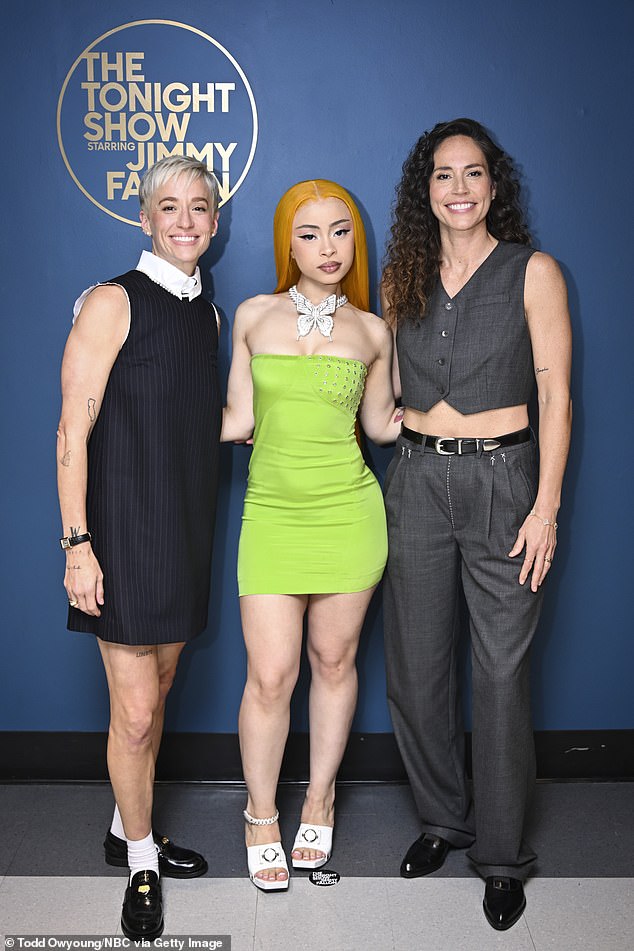 She also showed off her figure in a sleeveless lime green dress while posing backstage at Jimmy Fallon's show; pictured with Megan Rapinoe and Sue Bird on July 26.