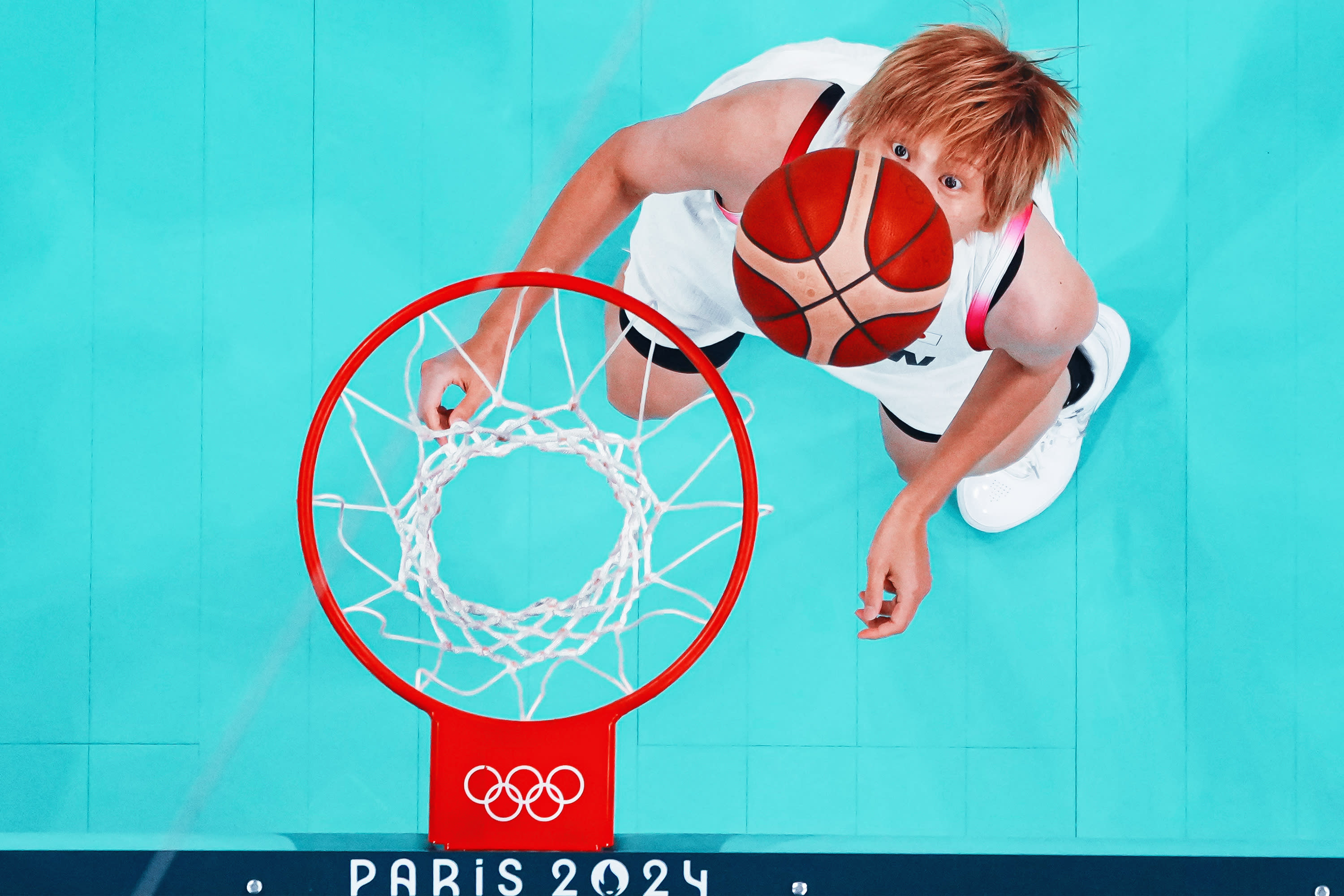 A general view shows Japan's No. 08 Maki Takada watching the ball in the women's preliminary round group C basketball match between Japan and Germany during the Paris 2024 Olympic Games at the Pierre-Mauroy stadium in Villeneuve-d'Ascq, northern France, on August 1, 2024. (Photo by -/POOL/AFP via Getty Images)