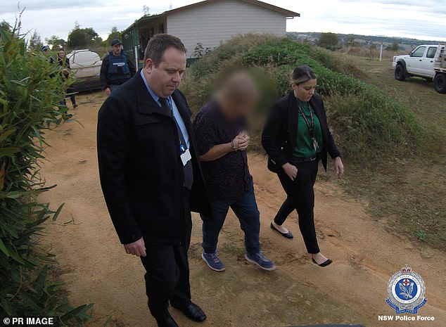 Anne Margaret Geeves (pictured during her arrest) and her husband have pleaded not guilty to murdering her teenage flatmate.