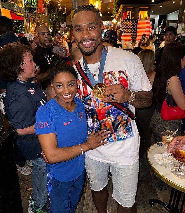 Biles' husband, NFL star Jonathan Owens, has been criticized by fans for wearing her Olympic gold medal