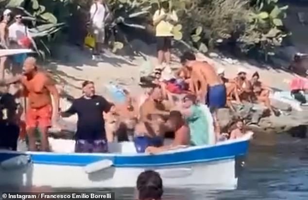 Witnesses said dozens of men could be seen throwing punches at each other as they argued over who would get the next ferry home.