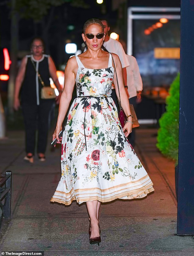 The 55-year-old singer sported a floral-print dress, maroon high heels and a matching handbag with sunglasses as she headed to a Cats preview in New York City.