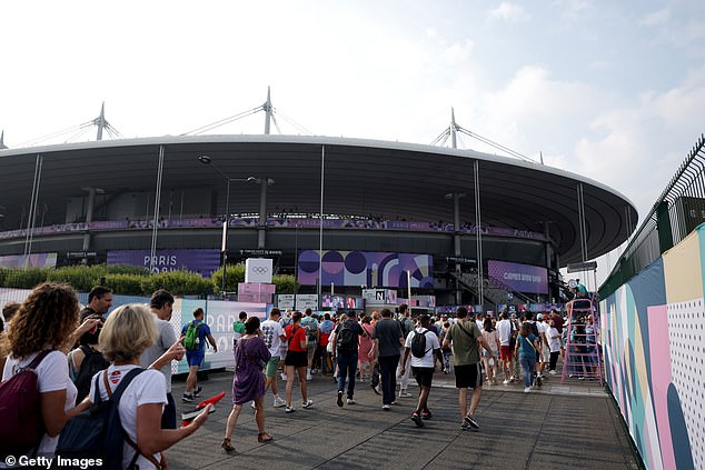 The Porte de Paris train station in Saint-Denis, located near the Stade de France stadium (pictured), has been cordoned off as police await the arrival of a specialist bomb squad.