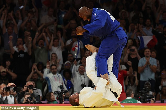 Tushishvili (below) kicked Riner (above) before pushing his face into the canvas during their fight.