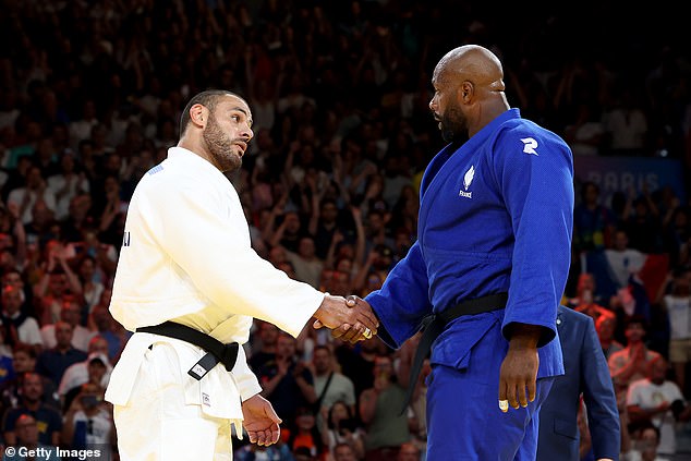 The pair later shook hands after Riner (right) was awarded the win.