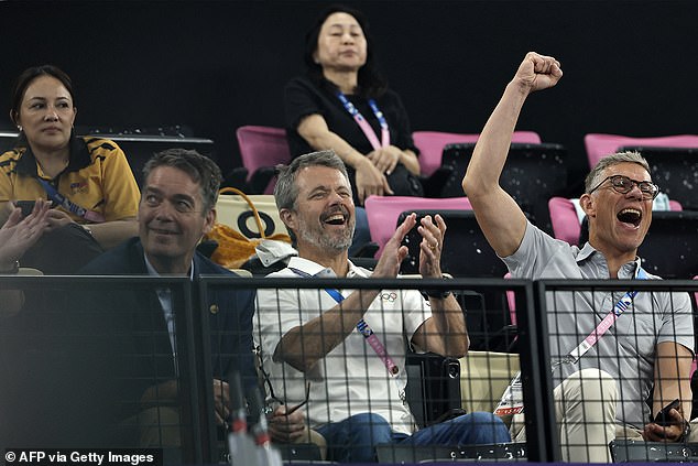 Frederik opted for casual summer attire, as he smiled in a white Olympic polo shirt and jeans.