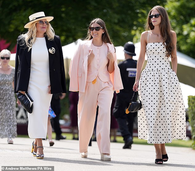 A group of revellers decided that less was more and so stepped out in a blush pink suit, a monochromatic strappy polka dot summer dress and a simple black and white blazer set.