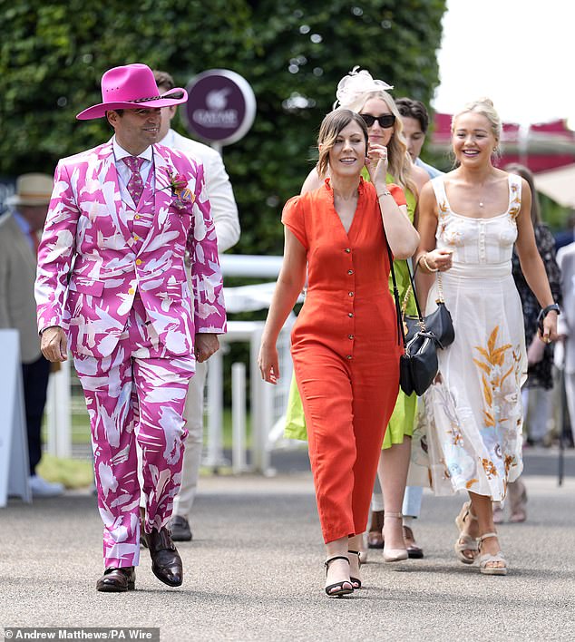 One man looked in high spirits as he sported a colorful pink and white three-piece suit.