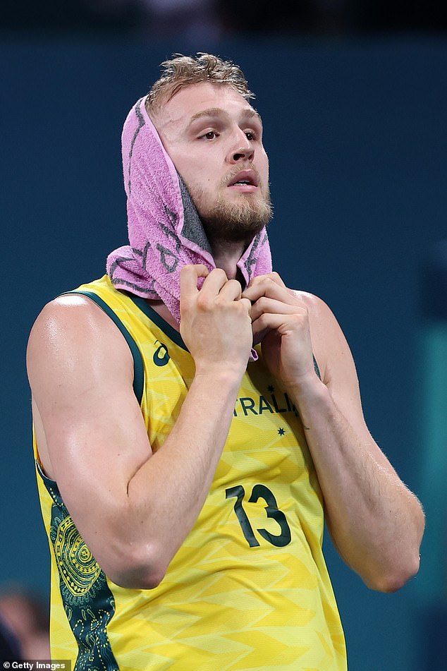 Team Australia's Jock Landale looks on after the game, which leaves them at risk of elimination.