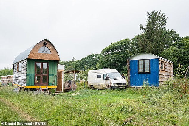 The couple said they built two tiny houses (pictured) made from recycled materials they collected.