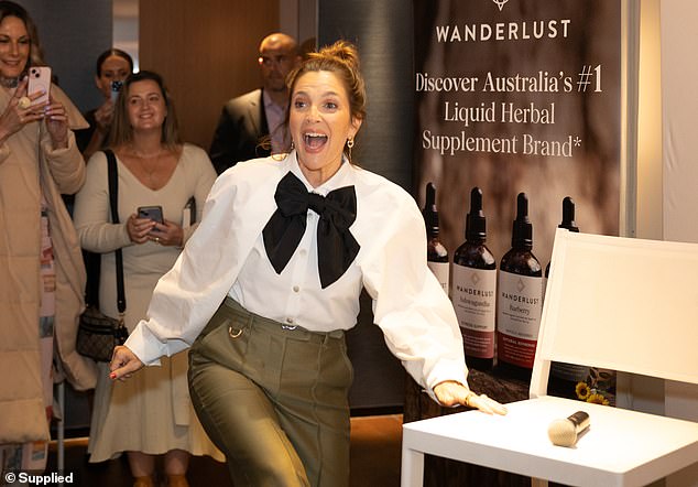 The moment came when Hollywood star Drew headlined wellness brand Wanderlust's True North talk (pictured speaking to reporters ahead of the show).