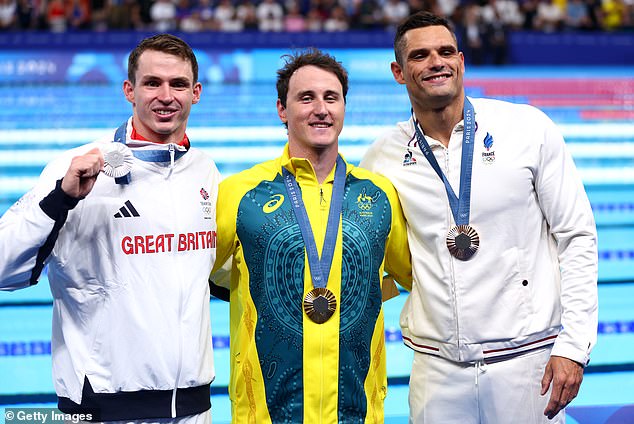 The Australian touched the wall in 21.25 seconds at the La Défense Arena ahead of Britain's Ben Proud and local hope Florent Manaudou (right)