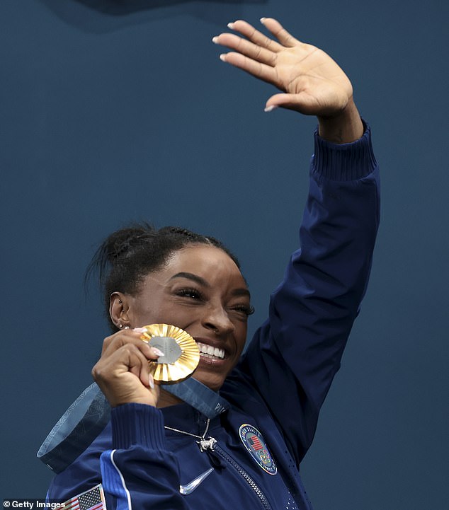 Biles waves to the crowd after winning her second gold medal at the Paris Games on Thursday