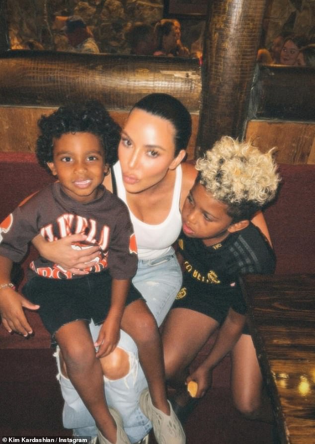 The businesswoman was seen posing with her two children in a photo, hugging her eldest son, Saint, as well as her youngest son, Psalm, who was sitting on her lap.