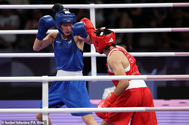 Imane Khelif (right) and Luca Anna Hamori during the women's 66kg quarter-final at the North Paris Arena today