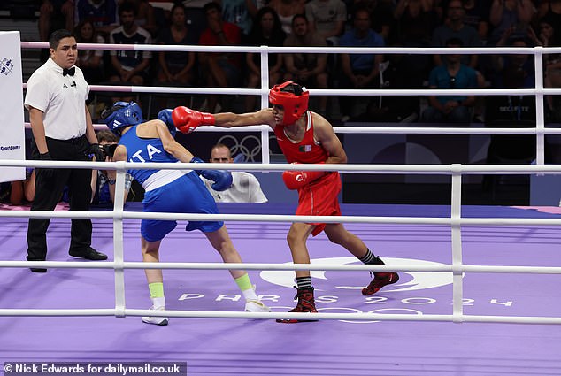 The Italian was stunned by the cross from Algeria's Imane Khelif (in red)