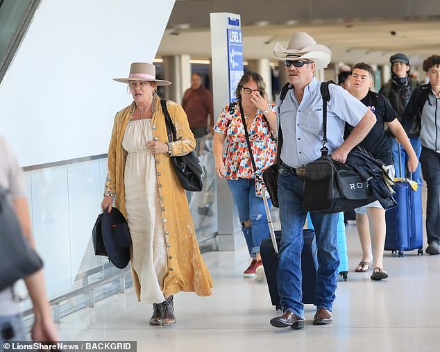 Weird Science star Kelly LeBrock, 64, looked like she hadn't aged a day as she left Los Angeles International Airport on Friday in a rare appearance.