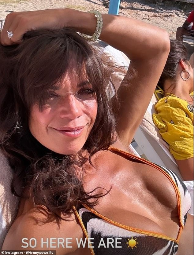 The No Limits host shared a photo of herself on her Instagram Stories as she lay back on a sun lounger and brushed her messy hair out of her face with one hand.