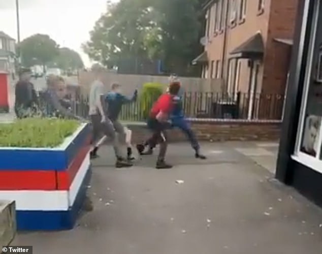 A man wearing a red T-shirt continues to trade blows with a youth in the clip, which was filmed in Cowgate, Newcastle Upon Tyne.