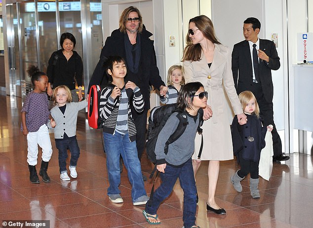 Pax is one of six children shared by Jolie and ex-husband Brad Pitt, 60. He was adopted in Vietnam in 2007 by his mother and the actor adopted him in 2008 (pictured in Tokyo in November 2008)