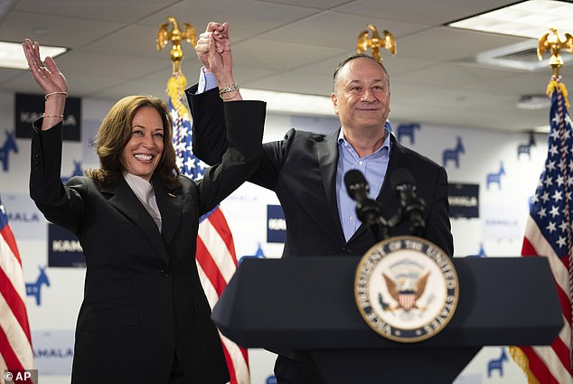 Vice President Kamala Harris, left, and second gentleman Doug Emhoff address staff at her campaign headquarters in Wilmington, Delaware.