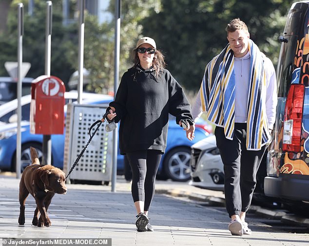 Danika, who opted for a casual look for the day, wore an oversized navy sweater and black leggings.