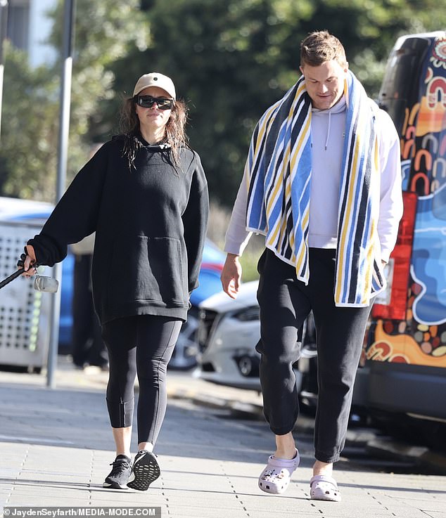 She decided to let her feet get some air in a pair of white Crocs.