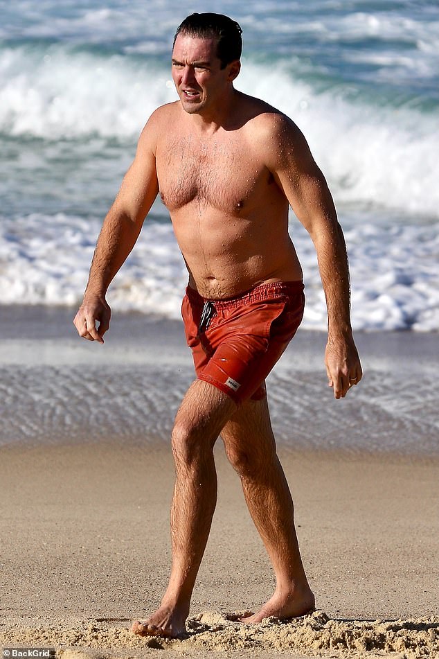 Despite the cold weather in Sydney, Peter finally went for a swim in the ocean with his son.