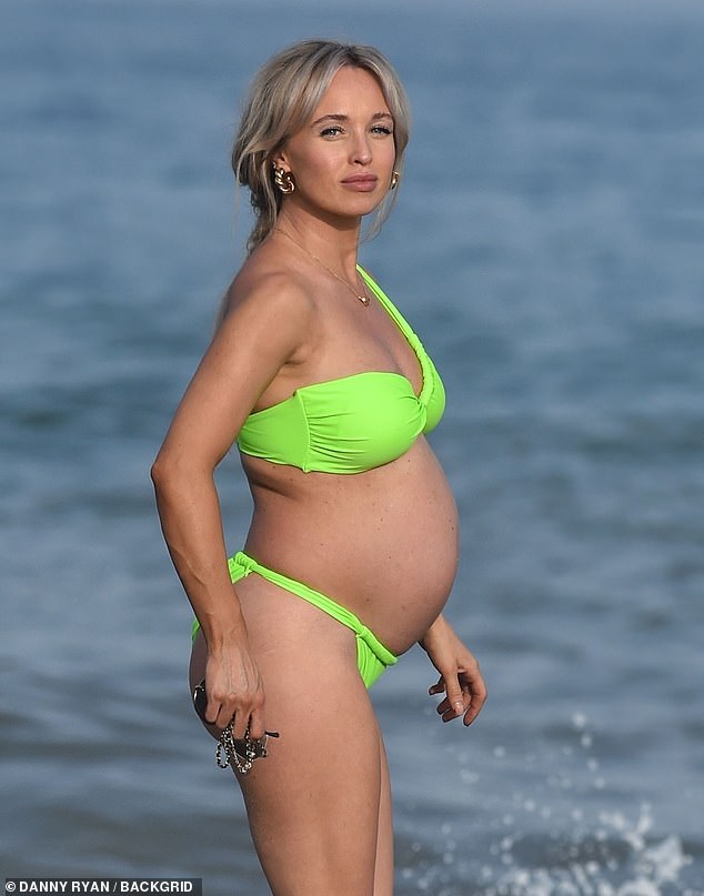 All eyes were on Jorgie as she strolled along the beach.