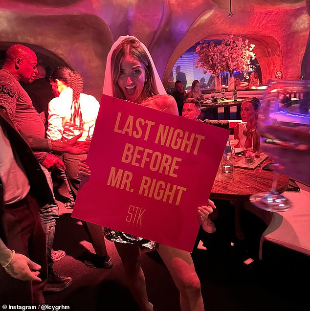 The stunning blonde held up a cheeky sign while partying at a bar, which read: 'Last night with Mr Right.'