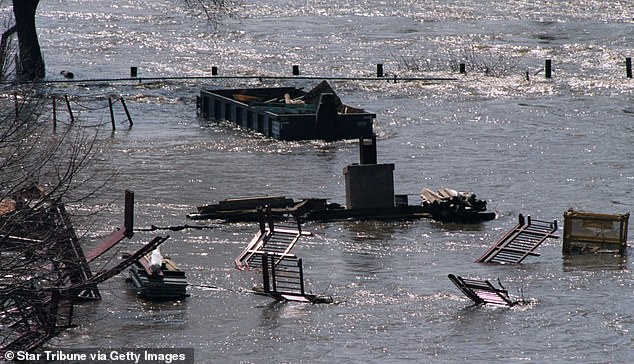 Pictured: Floodwaters turn roads into rivers in Minneapolis after torrential storm