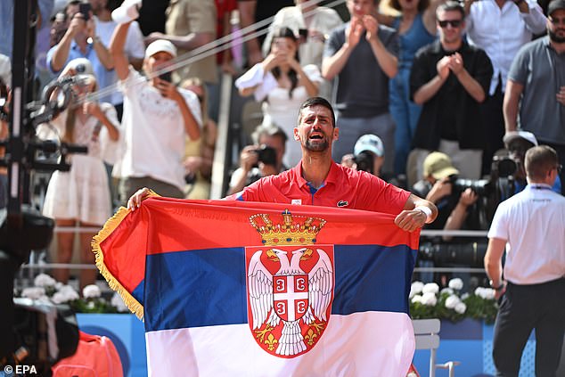 Djokovic was emotional as he raised a Serbian flag after ending his long wait for Olympic gold.