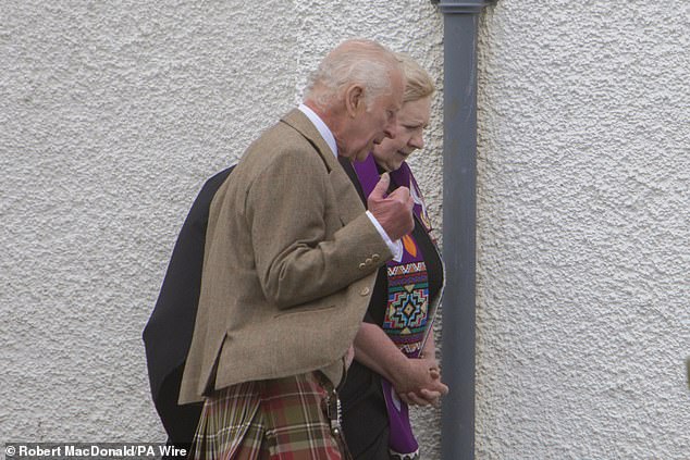 His Majesty was pictured having some trouble today outside Canisbay Parish Church, near the Castle of Mey.