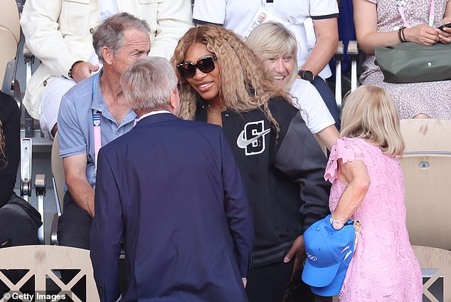 During the game, the Compton, California, native was seen speaking with IOC President Thomas Bach.