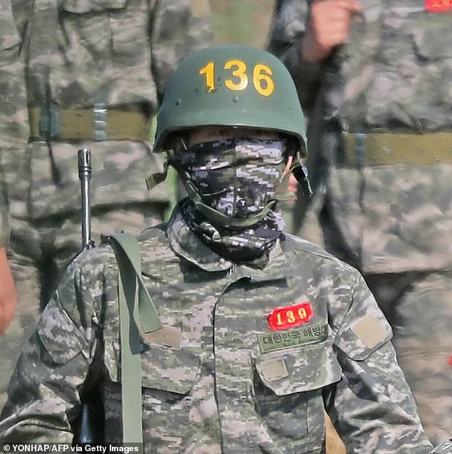 His son is pictured in military uniform during his basic training on Jeju Island in May 2020.