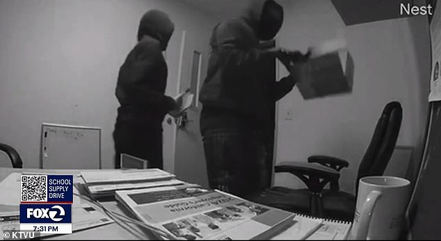 Two masked men looted more than a dozen small businesses located in the building and stole items worth an estimated $120,000.