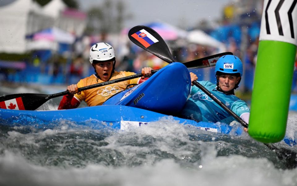 Two kayak cross participants collide