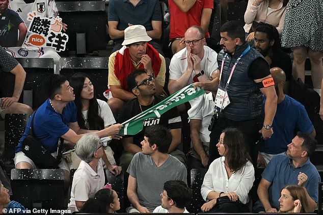 Security intervened when a fan tried to cheer on his team with a towel from Taiwan.