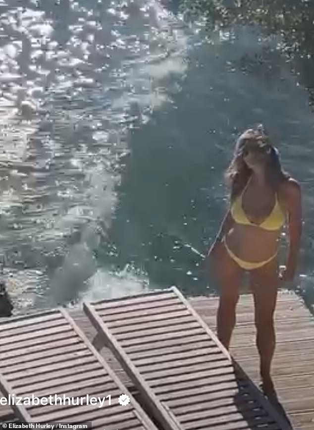 The spectacular clip, which she posted to her Instagram at the weekend, showed Elizabeth showering and sunbathing on a jetty before seductively rubbing sun cream on her body.