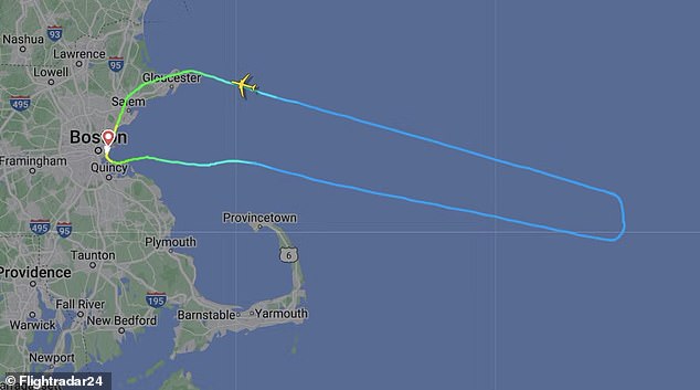 The flight had to turn around over the Atlantic Ocean and land again in Boston after the weather incident.