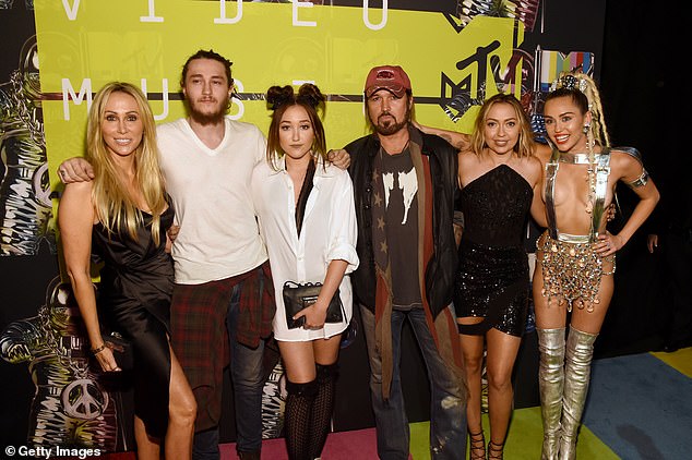 Billy Ray also has a tumultuous relationship with Tish Cyrus (left), his ex-wife of more than 30 years and mother of three of his biological children: Miley, 31 (right), Braison, 30 (second from left), and Noah, 24 (third from left). He is also the adoptive father of her two children, including Brandi, 37 (second from right).