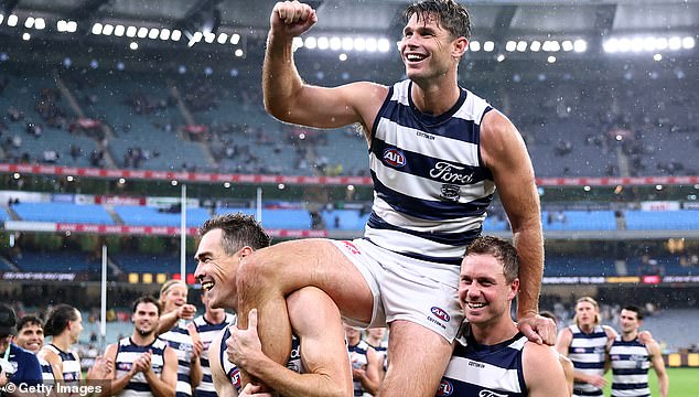 The 36-year-old has been a mainstay of the Geelong side since 2007 and holds the record for most appearances for the club (pictured being lifted off the ground in his 350th game).