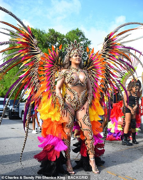 The Barbadian beauty was practically bursting out of the rest of her outfit, which was essentially a glitzy, opulent monokini.