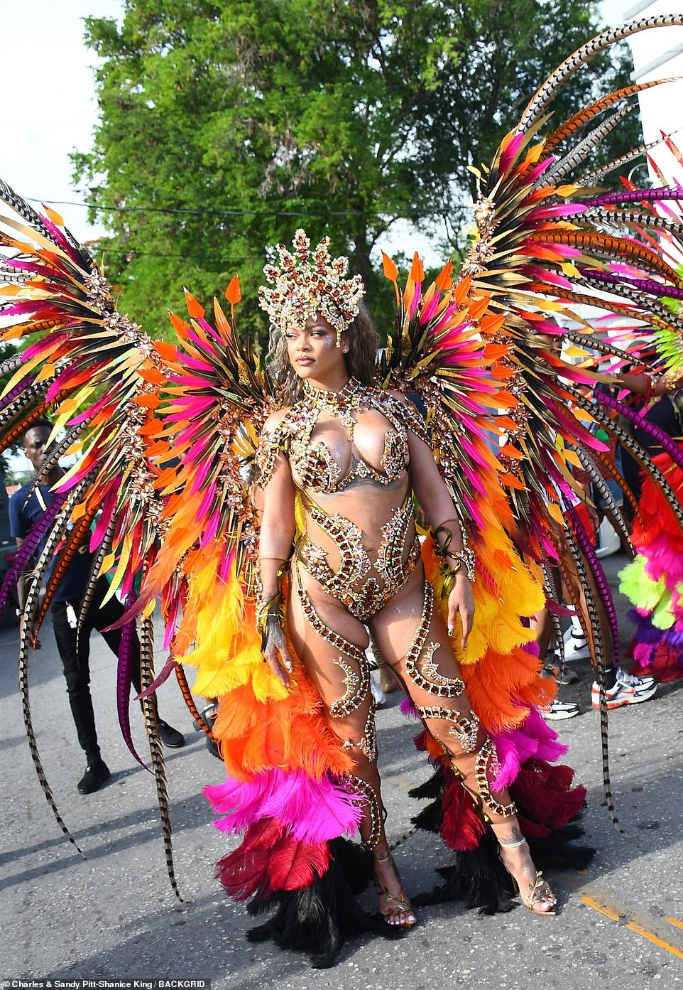 Strips of dark seahorse-shaped stones were arranged in arching strands along her legs and thighs, and she completed her costume with a pair of open-toed heels.