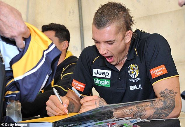 Martin is pictured signing autographs in 2014. Ten years later, he doesn't know what to do after closing the door on his stellar playing career.